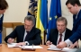 Dmitry Firtash and Mikhail Zgurovsky signing the Memorandum between Group DF and NTUU KPI