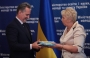 Doctor of Pedagogy, Academician Olga Yaroshenko presents chemistry textbooks authored by her to Dmitry Firtash, Head of the Joint Employers Movement of Ukraine