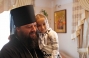 Father Superior of Holly Ascension monastery Archimandrite Longuin with an orphanage inmate