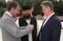 M. Papiev, Governor of Chernivtsi region, Dmitry Firtash and Father Superior of the Holy Ascension Monastery Rev. Longuin visit the Holy Trinity Cathedral construction site